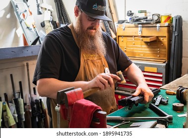 Placerville, USA - November 25, 2020: Gunsmith Working On An 300 Blackout AR Rifle Upper Receiver In A Gun Shop In California