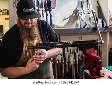 Placerville, USA - November 25, 2020: Gunsmith Working On An 300 Blackout AR Rifle Upper Receiver In A Gun Shop In California