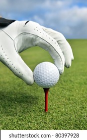 Placing Golf Ball On A Tee