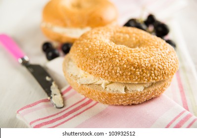 Plain ans Sesame Seed Bagels with Cream Cheese and Grapes - Powered by Shutterstock