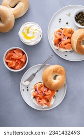 Plain bagel with salmon and cream cheese with fresh dill and capers for breakfast