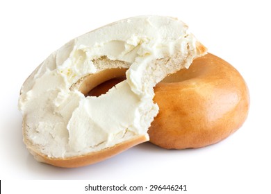 Plain Bagel Spread With Cream Cheese And Bite Missing. Isolated.