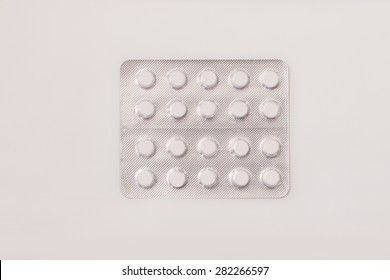 A Plain Blister Pack Of Small Round White Pills.