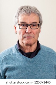 Plain Close Up Portrait Of An Senior European Man With Caucasian Background