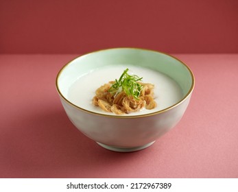 Plain Congee Served In A Dish Isolated On Mat Side View On Grey Background