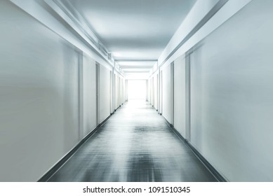 Plain corridor of a hospital motion blurred - Powered by Shutterstock