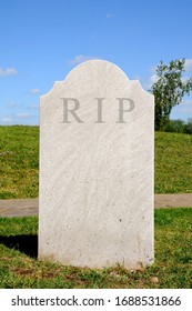 Plain Grey Textured Tombstone With The Letters RIP.