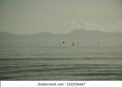 Plain landscape and mountains   sea  Calm sea   buoys it 