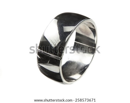 Plain large silver bracelet standing on white background