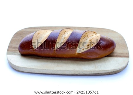 Plain Laugen bread on white background.