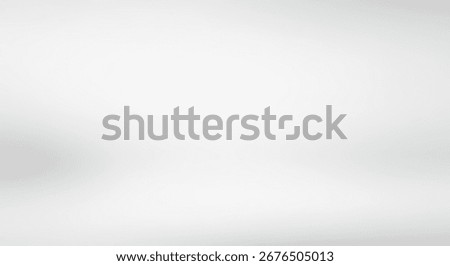 A plain, neutral backdrop featuring a soft, diffused light and subtle, blurred gradients.