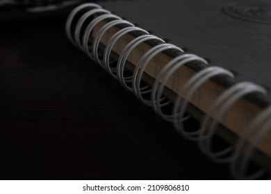 Plain Notebook And Blank Page No Line Paper Lay Flat Focusing On Black Spiral Binding Coil