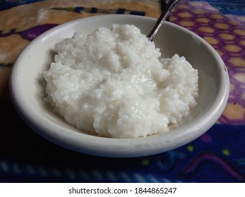 Plain Porridge On A White Ceramic Plate