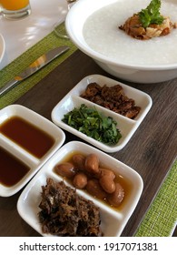 Plain Porridge Served With Condiments On The Side.