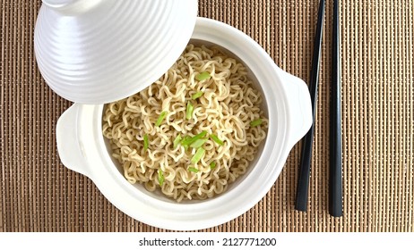 Plain Ramen Noodles Served On White Bowl With Lid