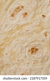 Plain Wheat Tortilla Wraps. Spanish Or Mexican Circular Unleavened Flatbread From Wheat Flour. Ingredient For Cooking Fast Food Or Snack. Closeup, Texture Background