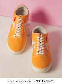 Plain Yellow Converse Sneakers Isolated On A Bright Background Are Very Popular Among Teenagers. A Simple Shoe Model That Is Perfect For School Or For Fashion. Free Space For Your Ad. Shoe Mockup.