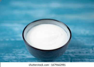 Plain Yogurt On A Decorative Blue Background. 