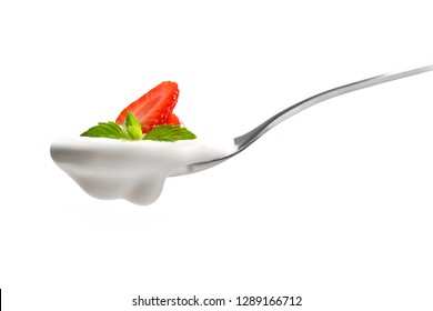 Plain Yogurt On A Spoon With Fresh Strawberry On Top Isolated On White Background