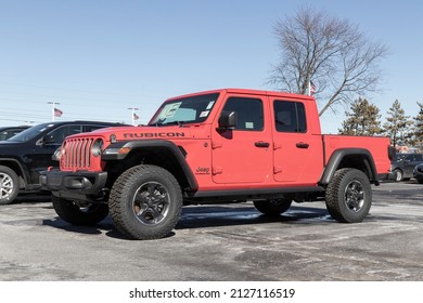 Plainfield - Circa February 2022: Jeep Gladiator display at a Stellantis Jeep dealer. The Jeep Gladiator models include the Sport, Willys, Rubicon and Mojave.