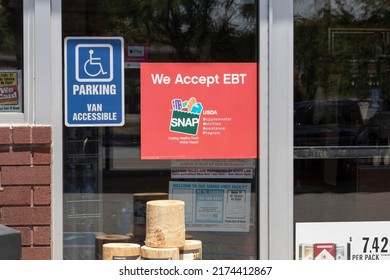 Plainfield - Circa July 2022: SNAP and EBT Accepted here sign. SNAP and Food Stamps provide nutrition benefits to supplement the budgets of disadvantaged families.