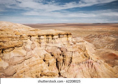 Plains of the flaming cliffs of Bayanzag, a region in the Gobi desert of Mongolia famous for discoveries of dinosaur eggs and fossils. Horizontal copy space