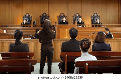 plaintiff or defendant talks to the judge in courtroom. The concept of legal adjustment Court of Justice and Legal Trial Speech to Judge Lawyer Lawyer Protects Client with Argument - Powered by Shutterstock