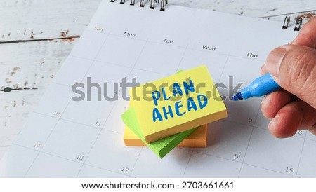 Plan Ahead Future Strategy Concept with Hand Writing on Sticky Notes Placed on Calendar