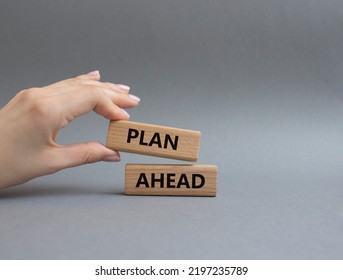 Plan Ahead Symbol. Wooden Blocks With Words Plan Ahead. Beautiful Grey Background. Businessman Hand. Business And 'Plan Ahead' Concept. Copy Space.