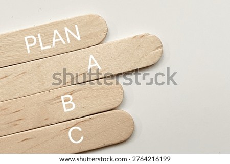 Plan A B C concept on wooden sticks representing strategy options, decision making, and business planning.