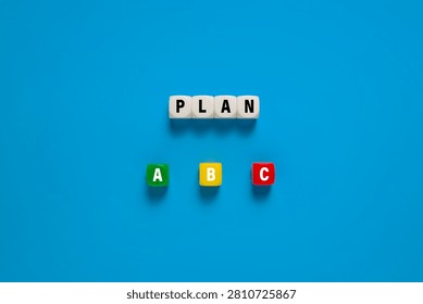 Plan a b c on colorful cubes. concept of plan choices for business strategy. isolated on blue background