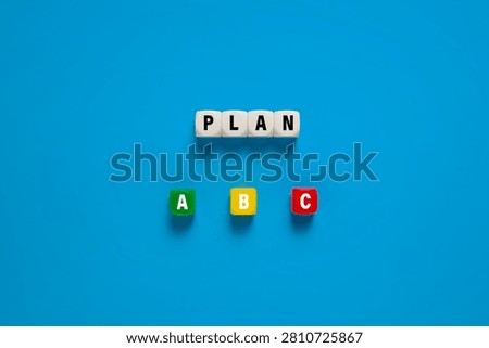 Plan a b c on colorful cubes. concept of plan choices for business strategy. isolated on blue background