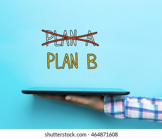 Plan B concept with a tablet on blue background