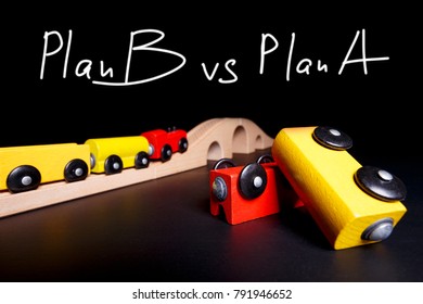 Plan B Is One Effective Step
Toy Train Rides On Rails Symbolizing An Effective Plan B. An Inverted Wagon Is A Concept When Plan A Has Suffered A Catastrophe 
