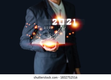 Plan business growth in year 2021 concept. Businessman plan and increase of positive indicators in his business, Growing up business concepts.
