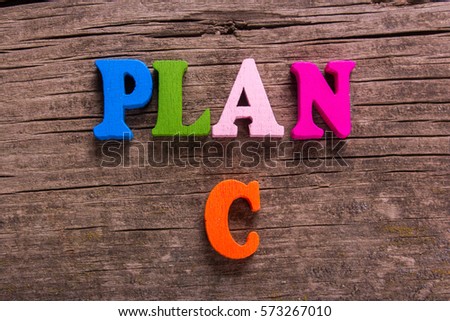 plan C word made from colored wooden letters on an old table. Concept