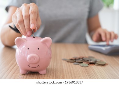 plan finance and savings money.young women put money coin in piggybank and calculate cost.