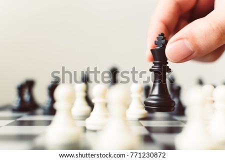 Plan leading strategy of successful business competition leader concept, Hand of player chess board game putting black pawn, Copy space for your text