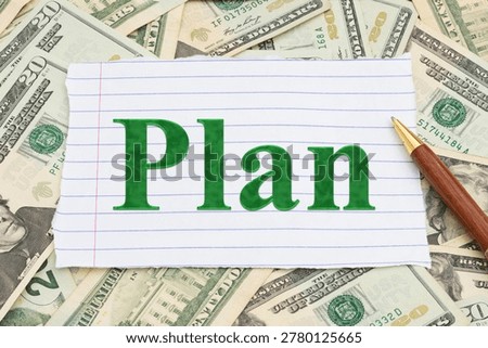 Plan message on lined paper with twenty dollar bill cash with pen for education, retirement, savings and budget