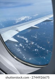 From the plan. View from airplane window, Looking through window aircraft during flight in wing