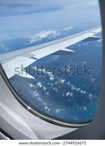 From the plan. View from airplane window, Looking through window aircraft during flight in wing