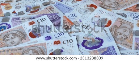 A plan view close up banner of sterling bank notes.	