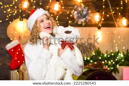 Plan where and how you are going to spend new year eve. Things to do before christmas. Woman with teddy bear toy christmas decorations background. Plan for some interesting Christmas activity