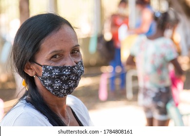 Planaltina, Goias, Brazil-July 25 2020: A Woman Wearing A Protective Mask While Waiting For Food At A Distribution Center For The Poor Of The Community