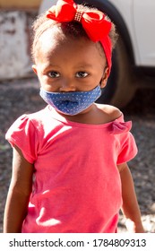 Planaltina, Goias, Brazil-July 25 2020: A Little Toddler Wearing A Protective Mask While Waiting For Food At A Distribution Center For The Poor Of The Community