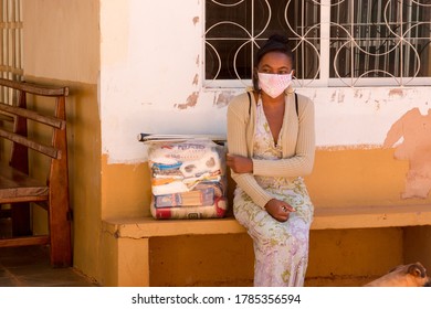 Planaltina, Goias, Brazil-July 25 2020: A Woman Wearing A Protective Mask While Waiting For Food At A Distribution Center For The Poor Of The Community