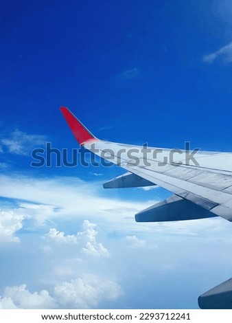 A plane, airplane, window seat airplane, view from a plane, air plane wings