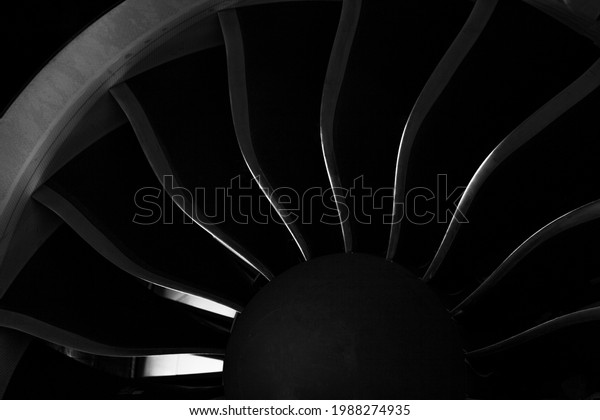 Plane background. Airplane\
turbine blades close-up. Airplane engine. Turbines blade. Aviation\
Technologies. Aircraft jet black detail during maintenance.\
Macro.