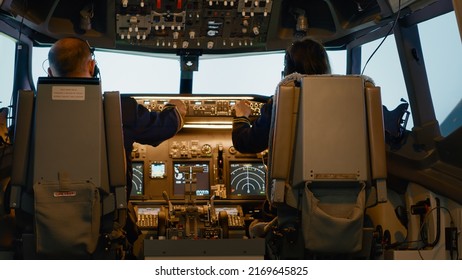 Plane captain and woman copilot fixing altitude on dashboard, using cockpit command with control panel to fly airplane. Aerial navigation to takeoff and use power engine, airline service.