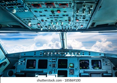 Plane Cockpit And Cloudy Sky